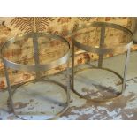 LOW TABLES, a pair, circular brass with glass tops, 50cm H x 50cm diam.