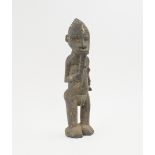 LOBI FIGURE, carved wood in the form of a man with traditional whistle,