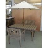 GARDEN FURNITURE, rectangular table weathered slatted with parasol, conforming armchair and a bench,