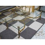 LOW TABLE, with a rectangular glass top on a distressed gilt metal base with curved,