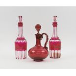 DECANTERS, a pair, red flashed and slice cut in the Bohemian manner,