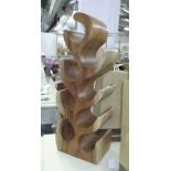 WOODEN WINE RACK, for eight bottles, carved solid wood, free standing, 72cm H x 26cm W.