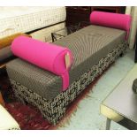 DAYBED, in a geometric upholstery with pink cushions from Colefax & Fowler,