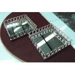 MIRRORED TRAYS, a pair, with interlocking gallery in chromed metal, 30cm x 30cm.