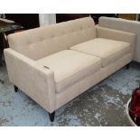 SOFA, two seater, in neutral button back fabric on square ebonised supports, 170cm L.