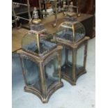 STORM LANTERNS, a pair in bronzed metal of square form with concave glass inserts,