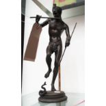 BRONZE FIGURE, a man with a snake, 34cm H.