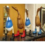 WOODEN RUNNER DUCKS, a set of four, retro art designs, carved solid wood, polished finish, 50cm H.