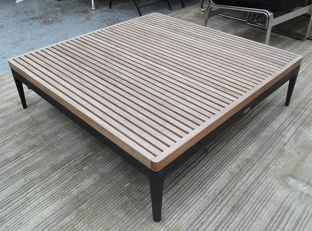 GARDEN LOW TABLE, by Gloster, with a slatted teak top on metal base, 103cm W x 103cm D x 31cm H.