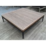 GARDEN LOW TABLE, by Gloster, with a slatted teak top on metal base, 103cm W x 103cm D x 31cm H.