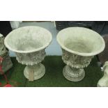 JARDINIERES, a pair, reconstituted stone with floral swag and pan decoration, 56cm H.