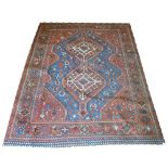 QASHQAI RUG, 215cm x 165cm, of double medallion and morgh design motifs on turquoise border.