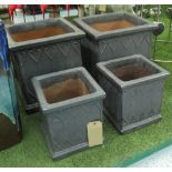 PLANTERS, a set of four, steel grey glazed with scroll decoration, two large 40cm x 42cm H,