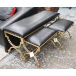 BENCH SET, black leather supported on gold frame base, largest 120cm x 40cm x 55cm H.