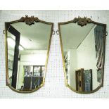 WALL MIRRORS, a pair, lozenge shape with gilt metal frames and reindeer crests, 62cm W x 94cm H max.