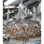 CHANDELIER, having six lights with round chrome frame and amber coloured faceted glass drops,