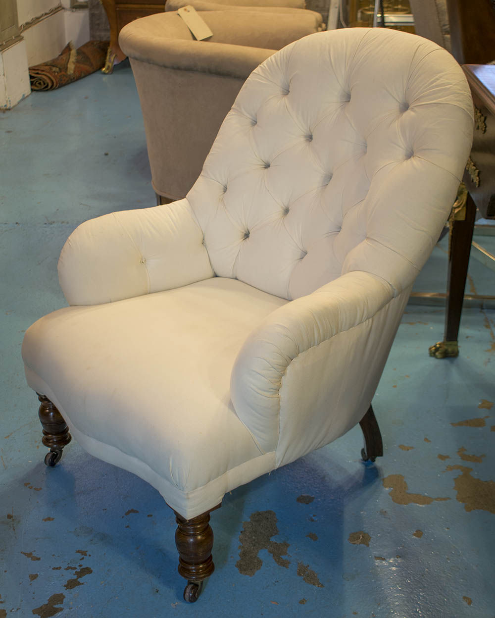 NURSERY CHAIR, Victorian walnut and white cotton button upholstered with turned supports.