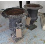 GARDEN URNS, a pair, cast metal in distressed dark finish, 45cm H x 32cm W.