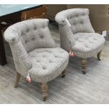 BEDROOM CHAIRS, a pair, in neutral buttoned fabric, French style on turned castor supports, 59cm W.