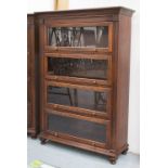 BOOKCASE, Victorian style, hardwood, with four glazed sliding doors raised on rounded feet,