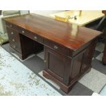 LOMBOK PEDESTAL DESK, Indonesian stained teak with six drawers and a panelled cupboard door below,