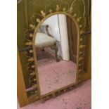 LOOKING GLASS, gilt metal frame with foliate and twist decoration around an arched plate,