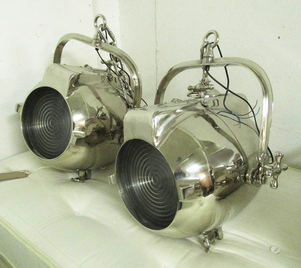 STUDIO LIGHTS, a pair, polished metal, of substantial proportions, approx. 50cm W x 60cm H.