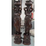 CARVED FIGURES, a pair, hardwood, each in the form of a Classical maiden holding an urn,