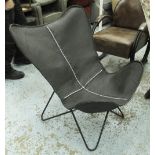 BUTTERFLY EASY CHAIR, in black leather on tubular black metal supports, 69cm W.