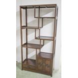 DISPLAY CABINET, Chinese hardwood with open shelves, above two doors and a drawer,