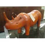 FOOTSTOOL, in tanned leather in the form of a rhinoceros, 86cm L.