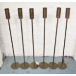 TEA LIGHT HOLDERS, a set of six, bronzed finish floor standing, 80cm H.