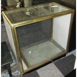 SHOP DISPLAY CABINET, with glass shelves within a brass effect frame, 105cm x 59cm x 103cm H.