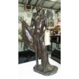 BRONZE OF A MALE, drying himself on a marble base, 59cm H.