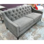SOFA, two seater, in grey fabric, button back on ebonised square supports,