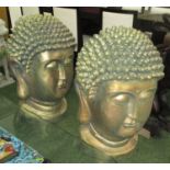 BUDDHA HEADS, a pair in resin with a gilded finish, 72cm H.