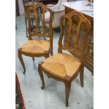 DINING CHAIRS, a set of six, Louis XV style fruitwood with drop in rush seats.