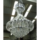 CHANDELIERS, a pair, curved perspex approx. 85cm H and a smaller one approx. 50cm H.