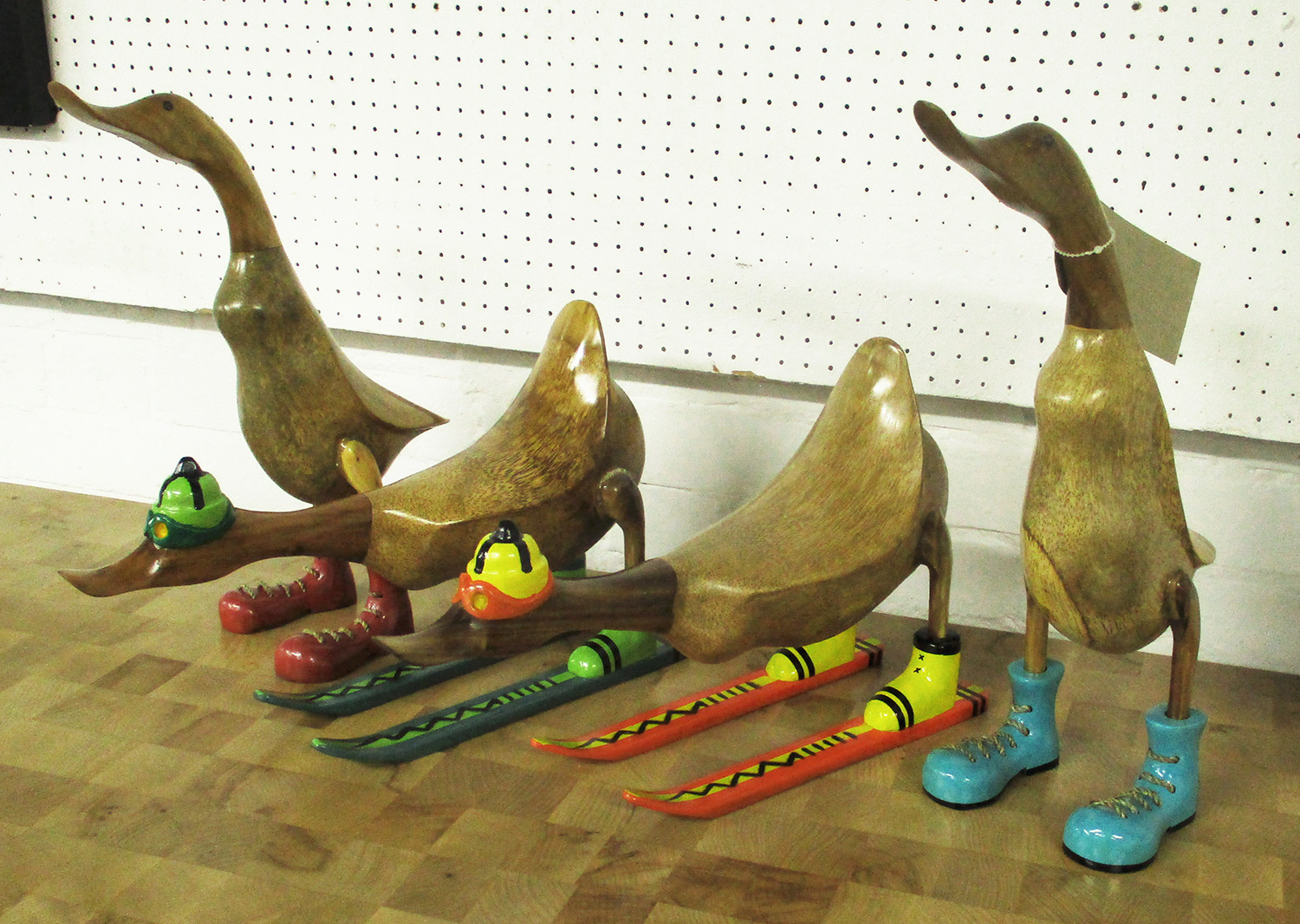 WOODEN 'RUNNER DUCKS', set of four, with two 'skiers', retro art designs, carved natural wood,