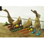 WOODEN 'RUNNER DUCKS', set of four, with two 'skiers', retro art designs, carved natural wood,