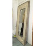 WALL MIRROR, extra large with an upholstered frame quilted with decorative gilt metal lattice,
