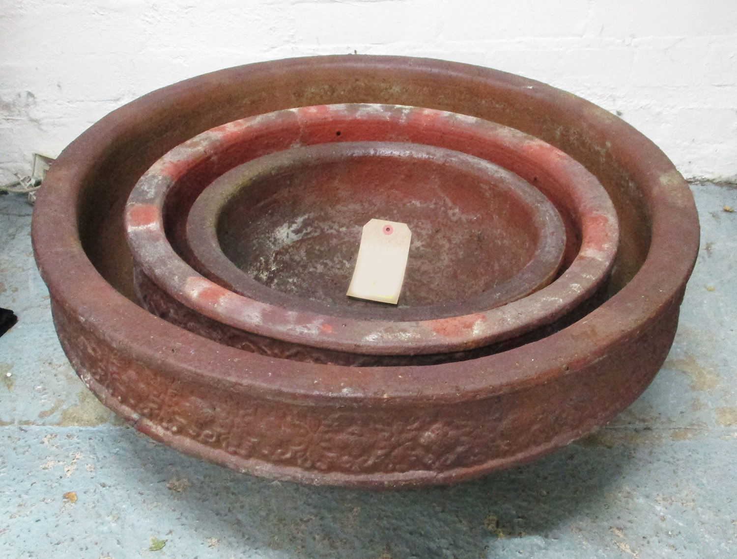 EARTHENWARE PLANTERS, a graduated set of three.