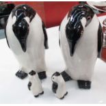PENGUINS, a family of four in ceramic, largest 39cm H.