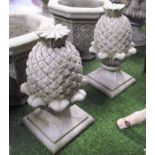 FINIALS, a pair, reconstituted stone, in the form of pineapples, 50cm H.