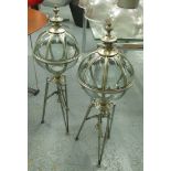 STORM LANTERNS, a pair, globular glazed on chromed metal tripod bases, 96cm H.