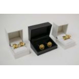 CHRISTIAN LACROIX CUFFLINKS, three various gold tone pairs.