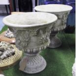 PLANTERS, a pair, reconstituted stone, with floral swags and 'pan' head decoration, 56cm H.