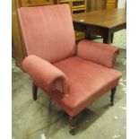 ARMCHAIR, with red upholstery on short turned front supports with castors, 89cm W.