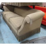SOFA, brown traditional style, outswept arms with bullion fringe, 83cm D x 89cm H x 252cm W.