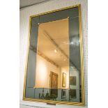 WALL MIRROR, mid 20th century gilt framed with rectangular peach centre plate and blue glass border,